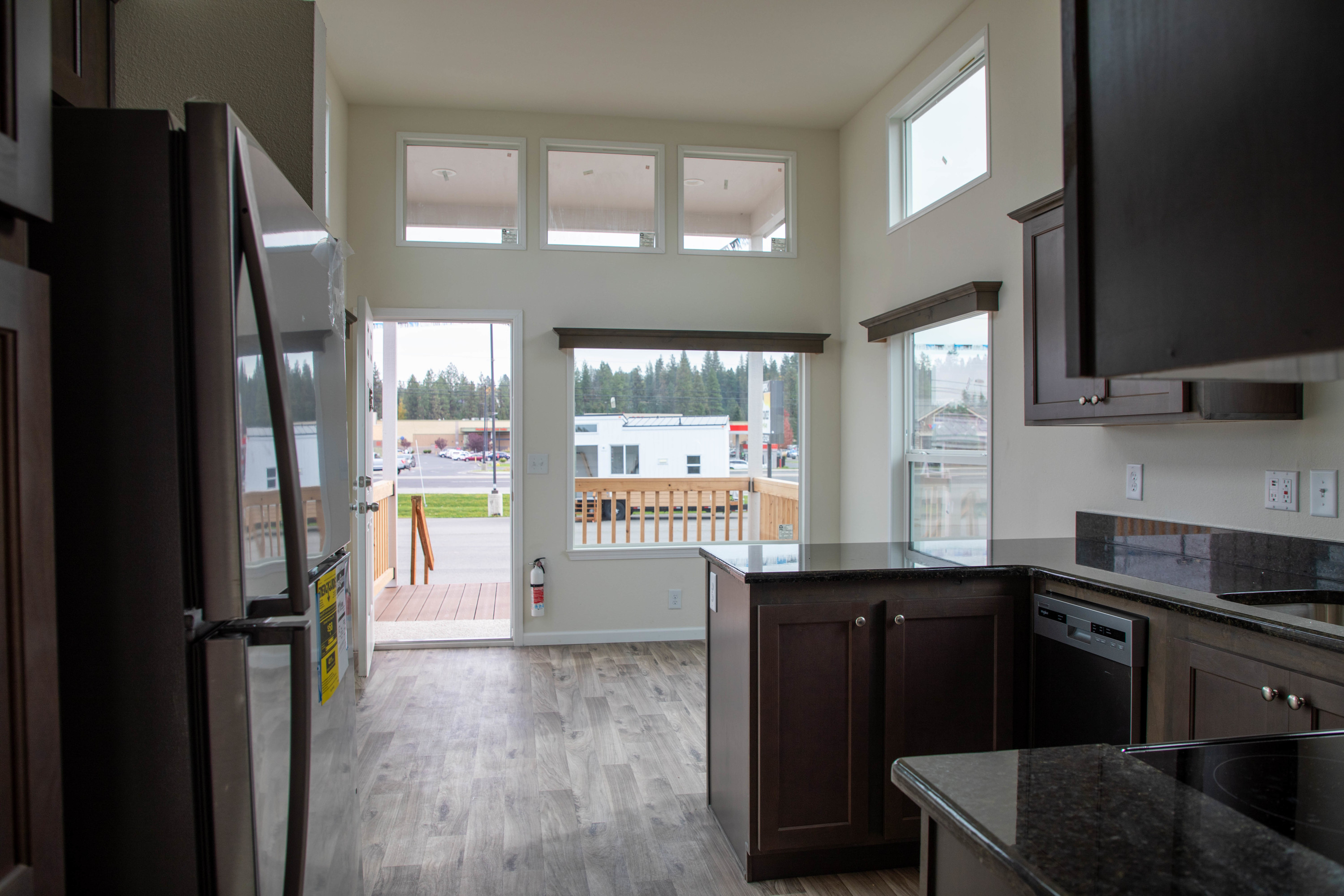 Large front windows with high ceiling